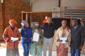 PIC 1. Receiving thier title deeds Thethane Ntshelo 81 years and Matshekiso Julie 56 years with MEC Maine (Middle)with MEC for Social Development Fenny Gaolaolwe