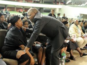 Minister Fikile Mbalula pays his respects to Tsholofelo Bozwana, wife of prominent businessman Wandile Bozwana during his funeral service at NG Kerk Moreleta Park in Pretoria east. Photo: Thobile Mathonsi