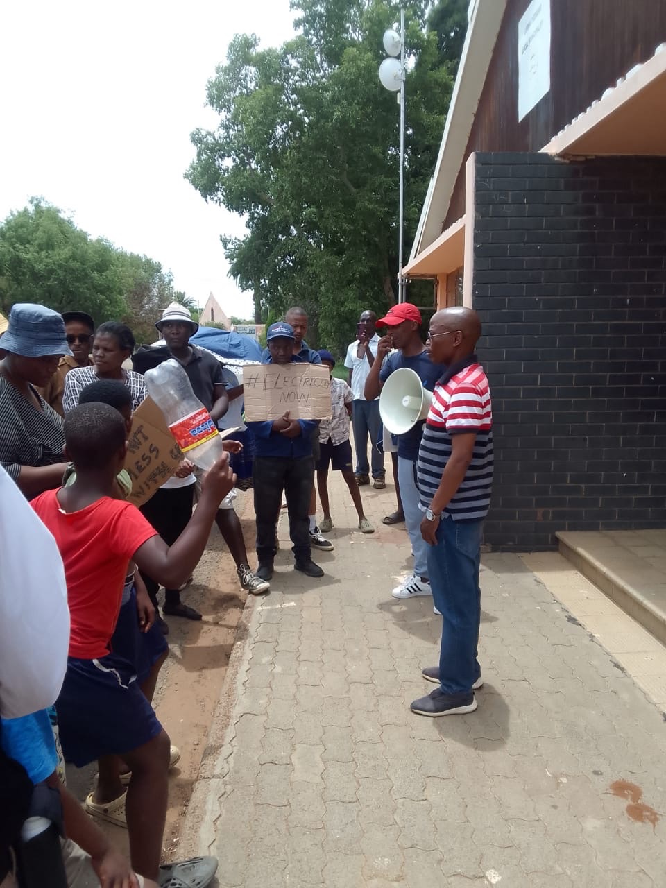 Community members march against poor basic services | The Guardian