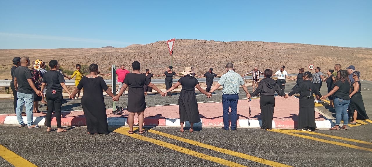 Community members gather in prayer after a loss of lives | The Guardian